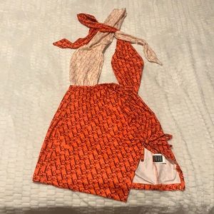 This dress this white with orange also have LOVE letters, size S.